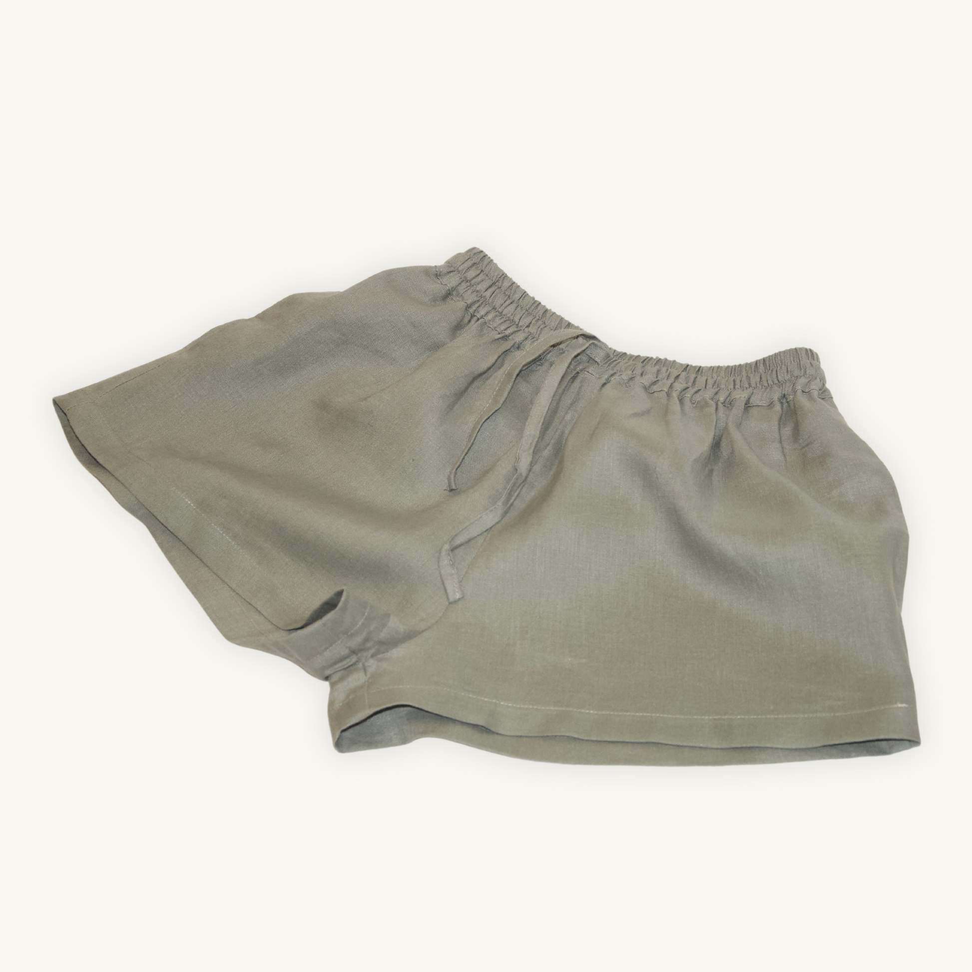 Olive Green 2-inch linen shorts, crafted from lightweight, breathable fabric, ideal for casual and summer wear.