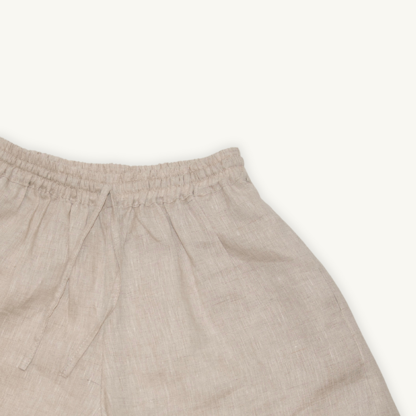 Natural beige 2-inch linen shorts, crafted from lightweight, breathable fabric, ideal for casual and summer wear.