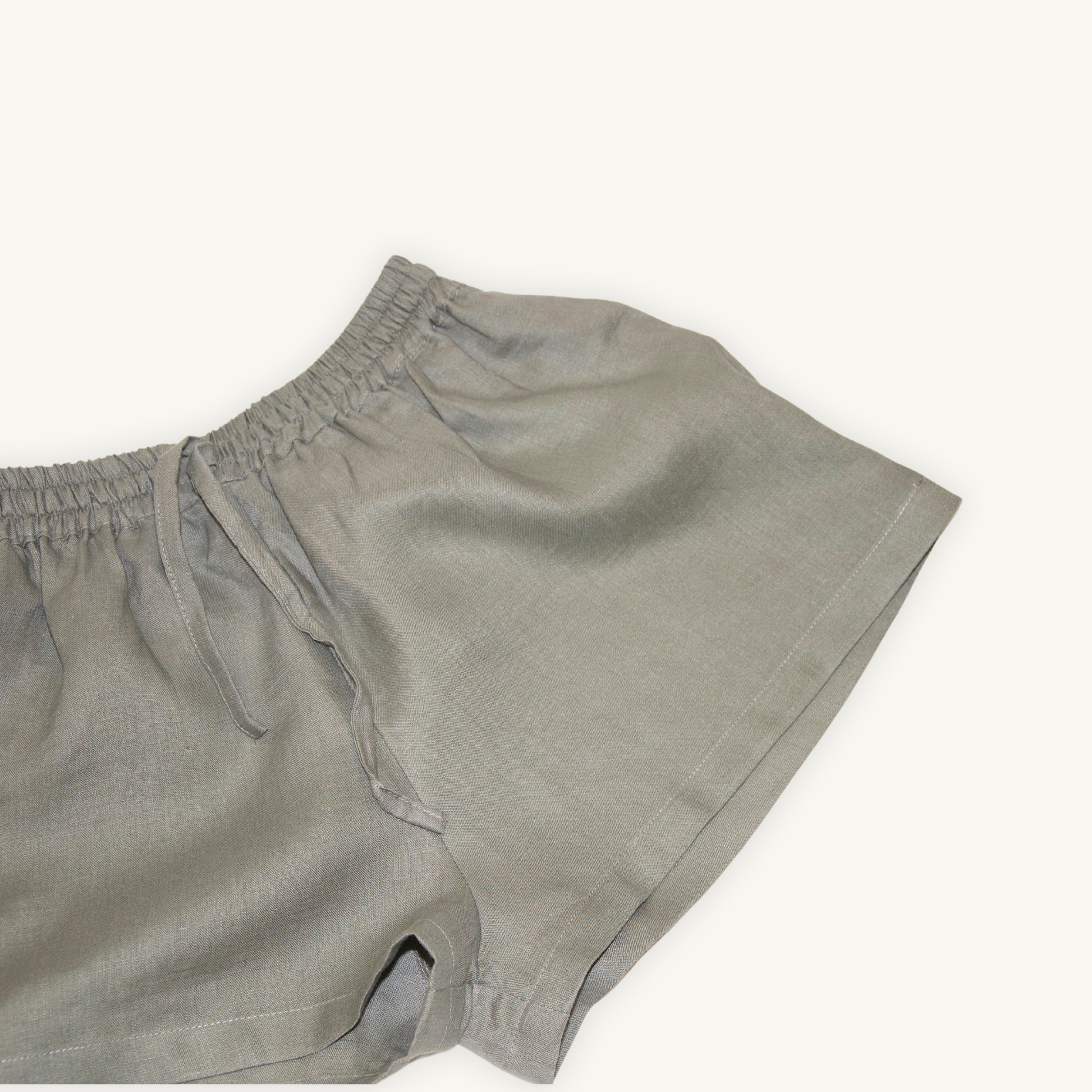 Olive Green 2-inch linen shorts, crafted from lightweight, breathable fabric, ideal for casual and summer wear.