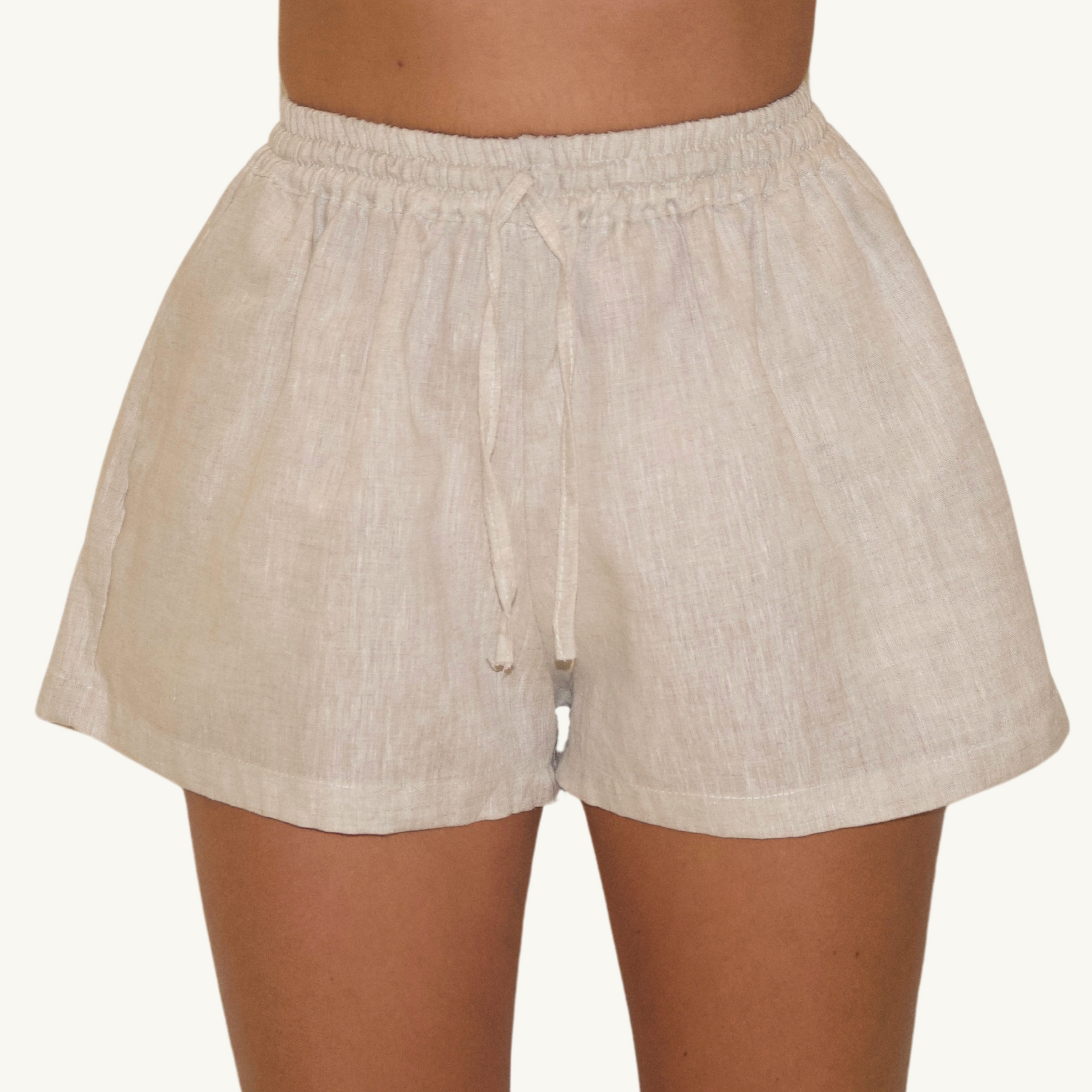 Natural beige 2-inch linen shorts, crafted from lightweight, breathable fabric, ideal for casual and summer wear.